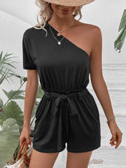 Black belted one-shoulder romper with ruffled waist and tie detail