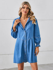 Denim shirtdress in dark blue with ruffled cuff sleeves and button front.