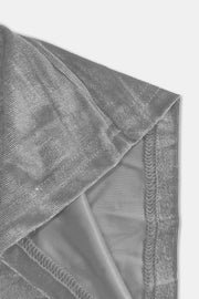 Plush velvet wide-leg trousers in gray, showing fabric texture and stitching detail.
