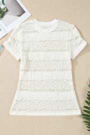 White sheer lace t-shirt with smocked texture and floral patchwork details.