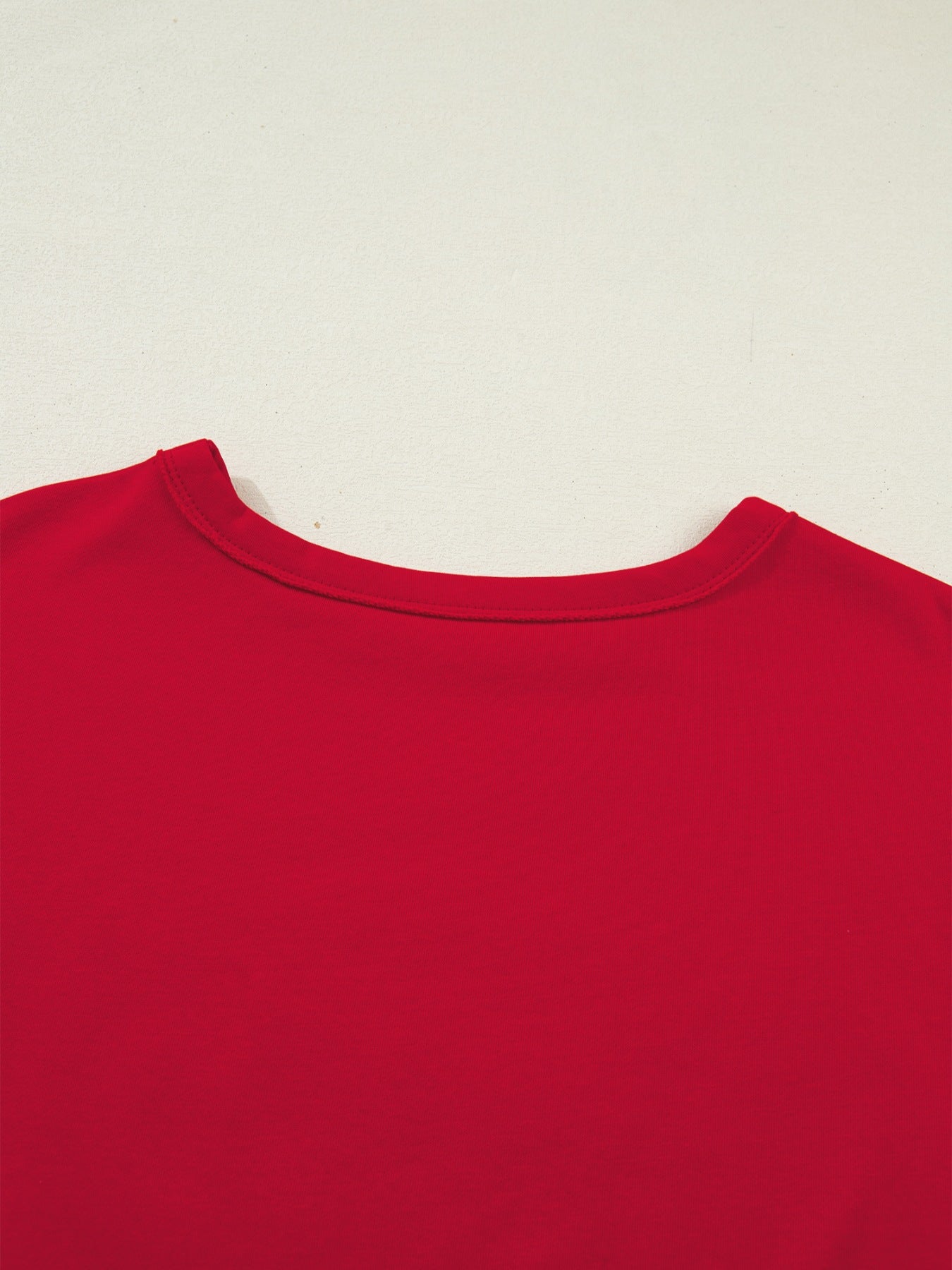 Red cotton blend crew neck t-shirt with drop shoulders.