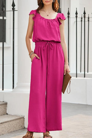 Hot Pink Textured Ruffle-Sleeve Drawstring Palazzo Jumpsuit with wide legs and pockets.