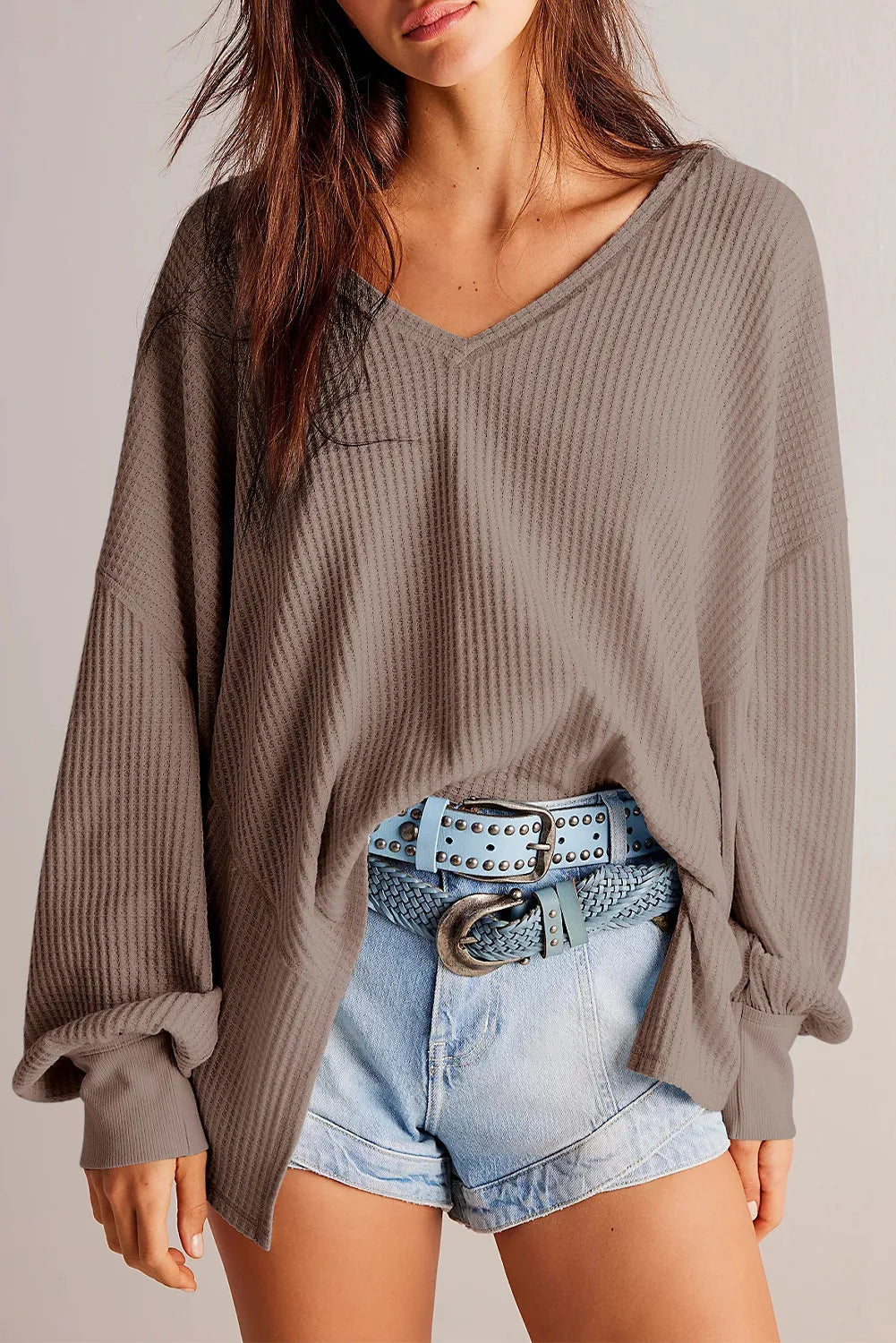Waffle knit blouson sleeve top in mocha with V-neck and cuffed sleeves.