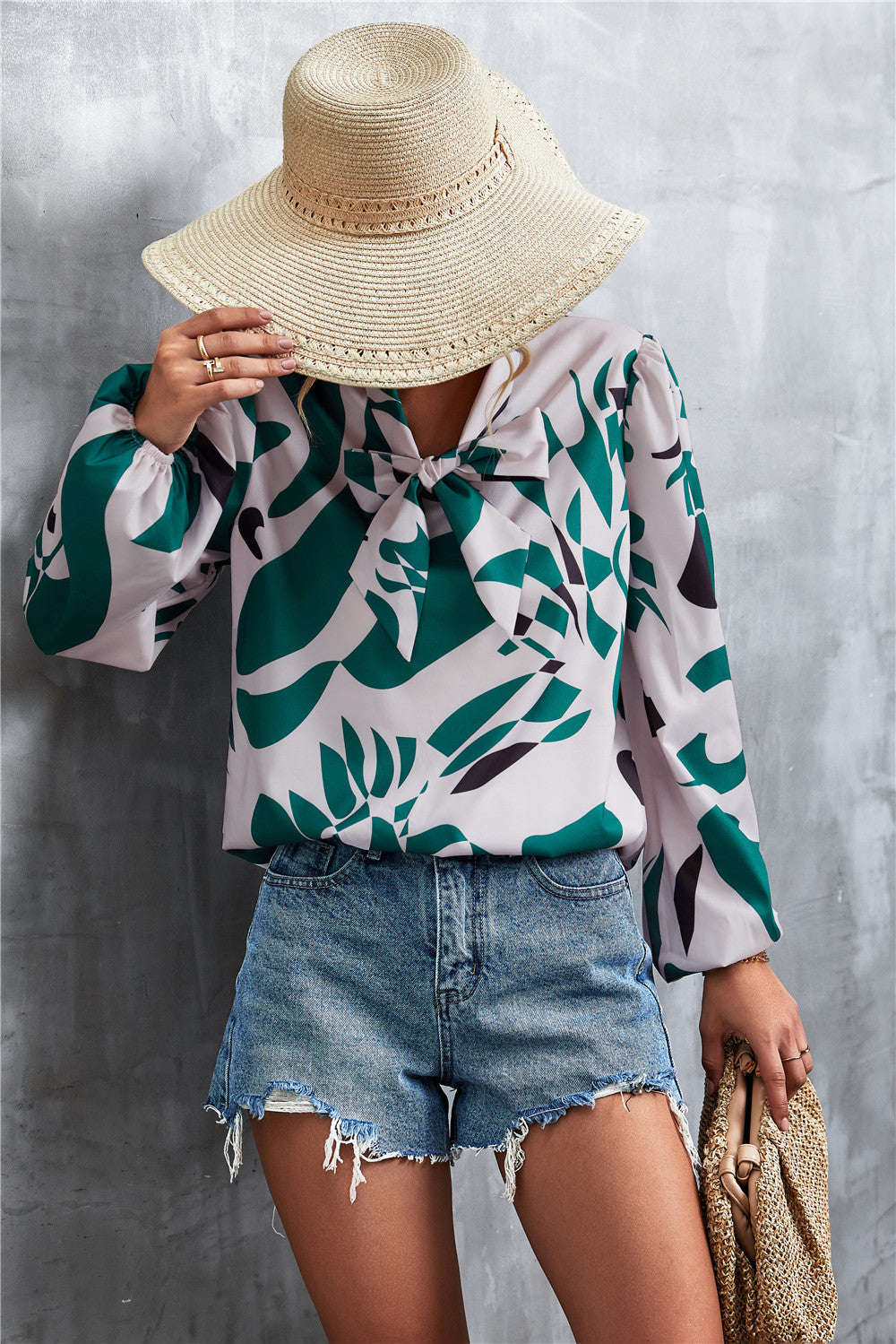 Abstract print green and white pussy bow blouse with balloon sleeves.