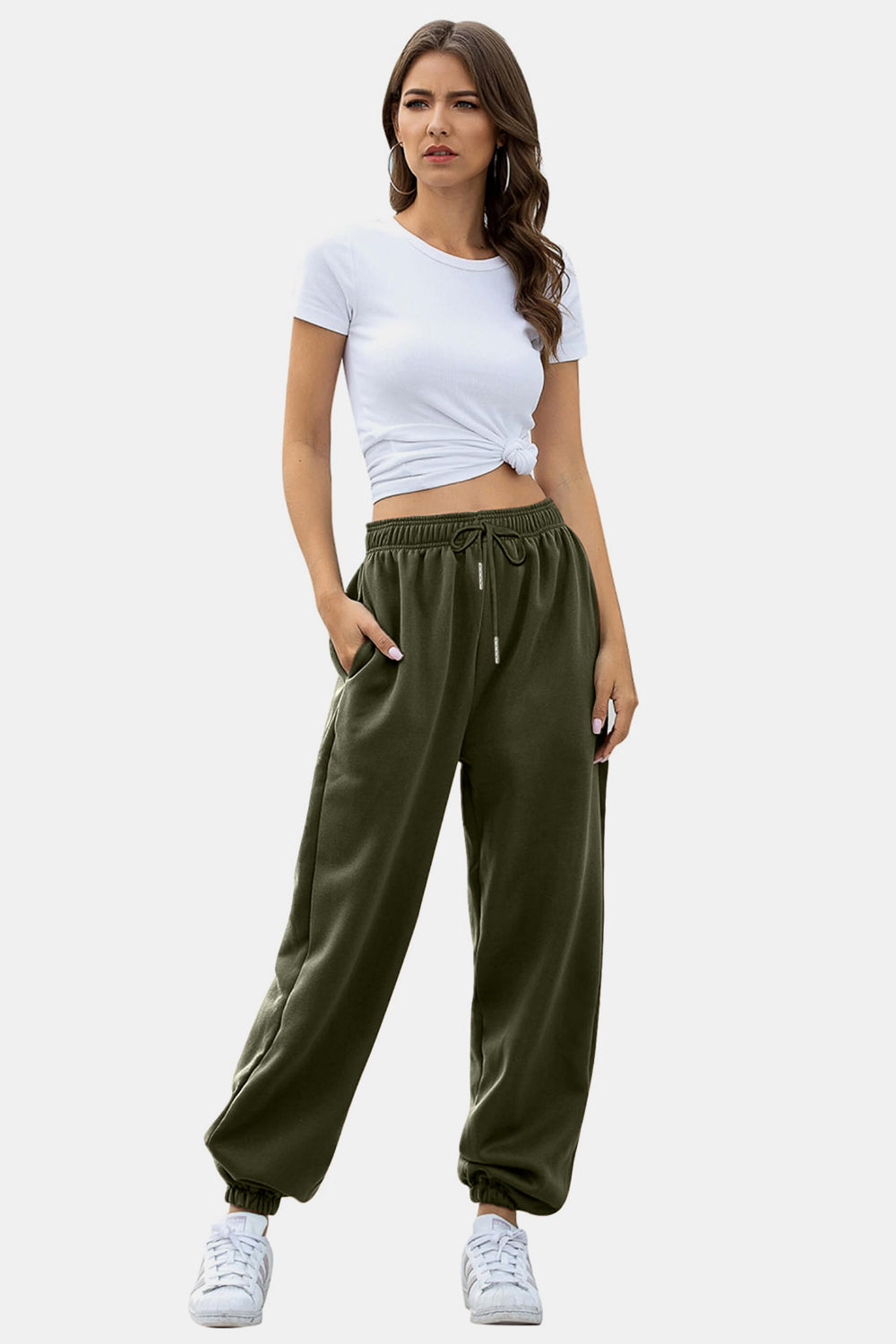 Slouchy gathered-cuff sweatpants in army green with drawstring waist and pockets.