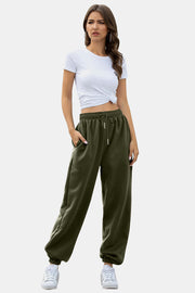 Slouchy gathered-cuff sweatpants in army green with drawstring waist and pockets.