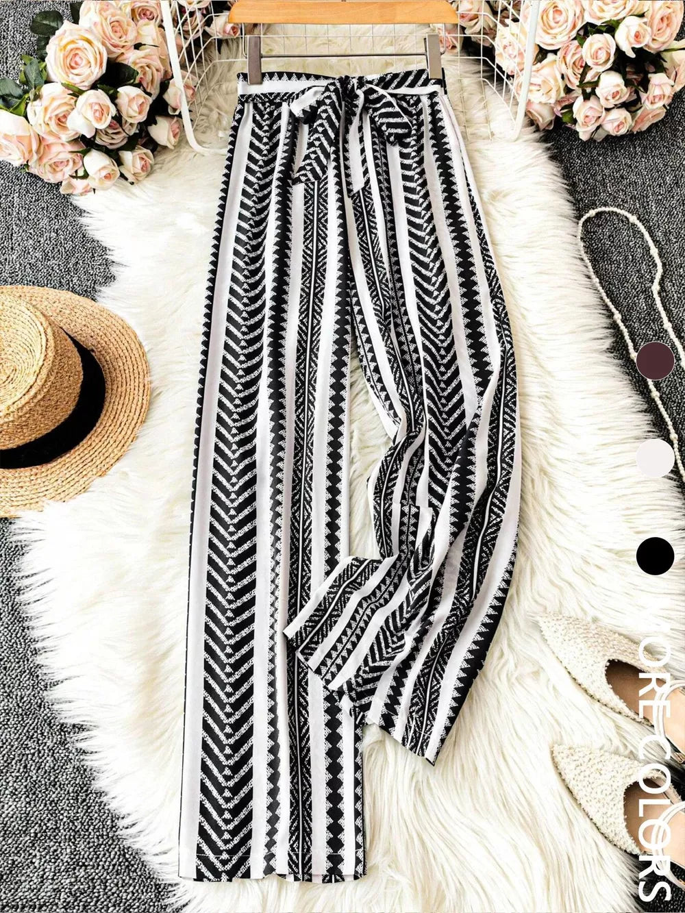 Geometric print wide-leg maternity pants with bow tie waist in black and white.