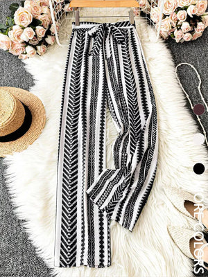 Geometric print wide-leg maternity pants with bow tie waist in black and white.