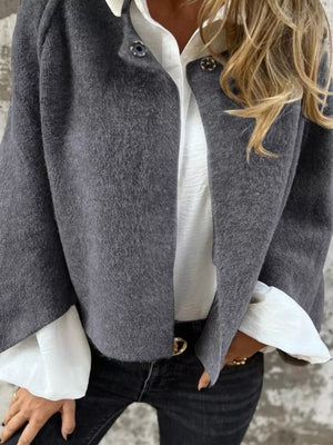 Gray fuzzy knit cardigan with button detail, open front, long sleeves.