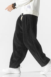 Black corduroy wide-leg cargo pants with a relaxed fit.