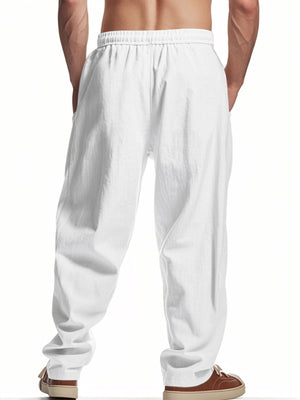 Men's white drawstring sweatpants with pockets and a relaxed fit.