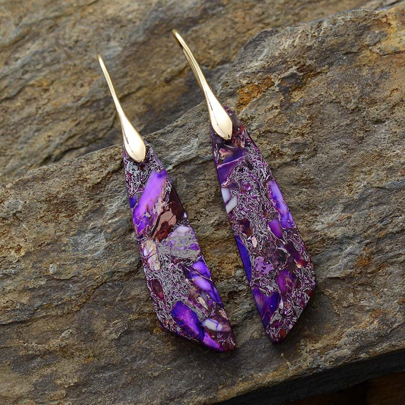 Purple gold dangle earrings with marbled stone and gold accents.