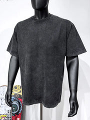 Black acid wash oversized tee with distressed neckline and hem.