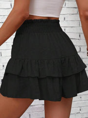 Black tiered ruffle skort with smocked waist, 100% polyester