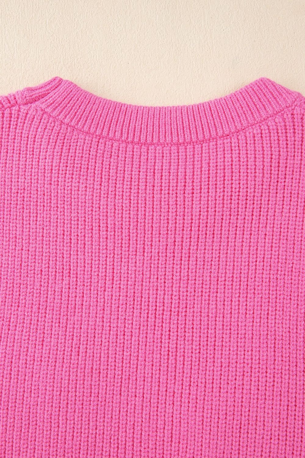 Fuchsia pink ribbed knit vest with crew neck detail