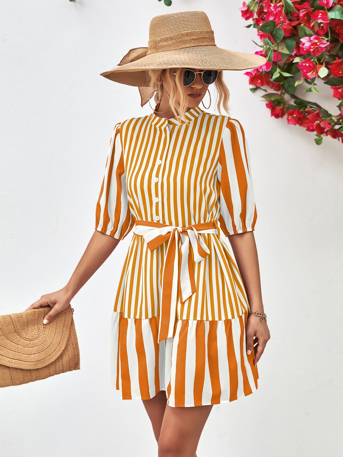 Vertical stripe shirred waist dress in gold with tie belt and tiered skirt.