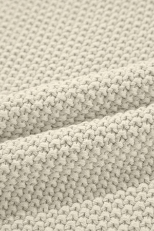 Boxy knit turtleneck shell in beige with a textured stitch pattern