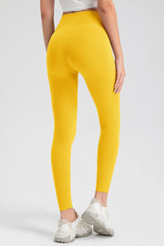 Yellow high-waist performance leggings with sculpting seam detail