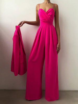 Rose Red ruched spaghetti strap wide-leg jumpsuit with a matching blazer draped over arm.