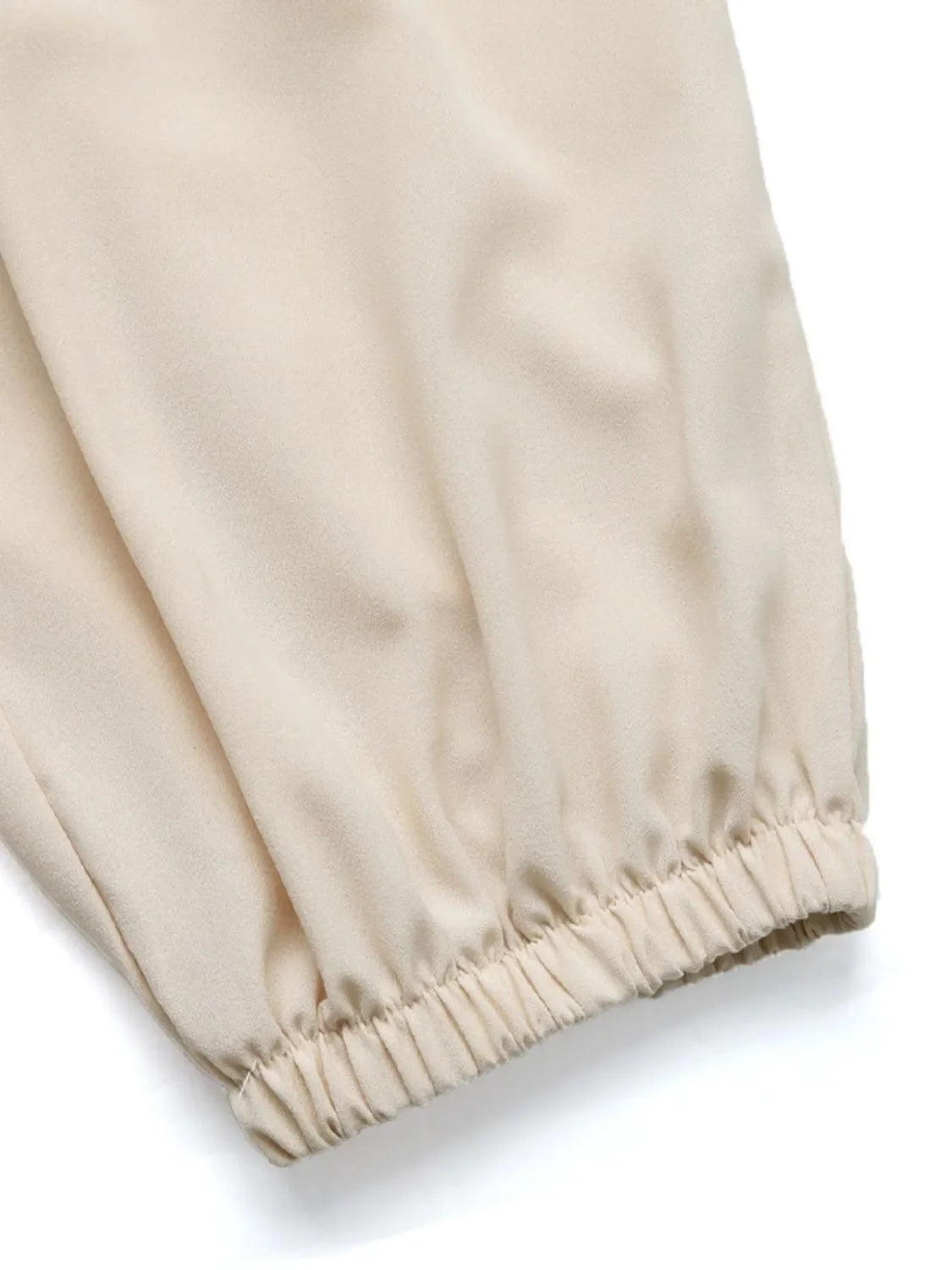 Cream ruched waistline balloon trousers with elasticated cuffs