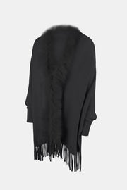 Black faux fur trimmed fringe cape with long sleeves and a boho style.
