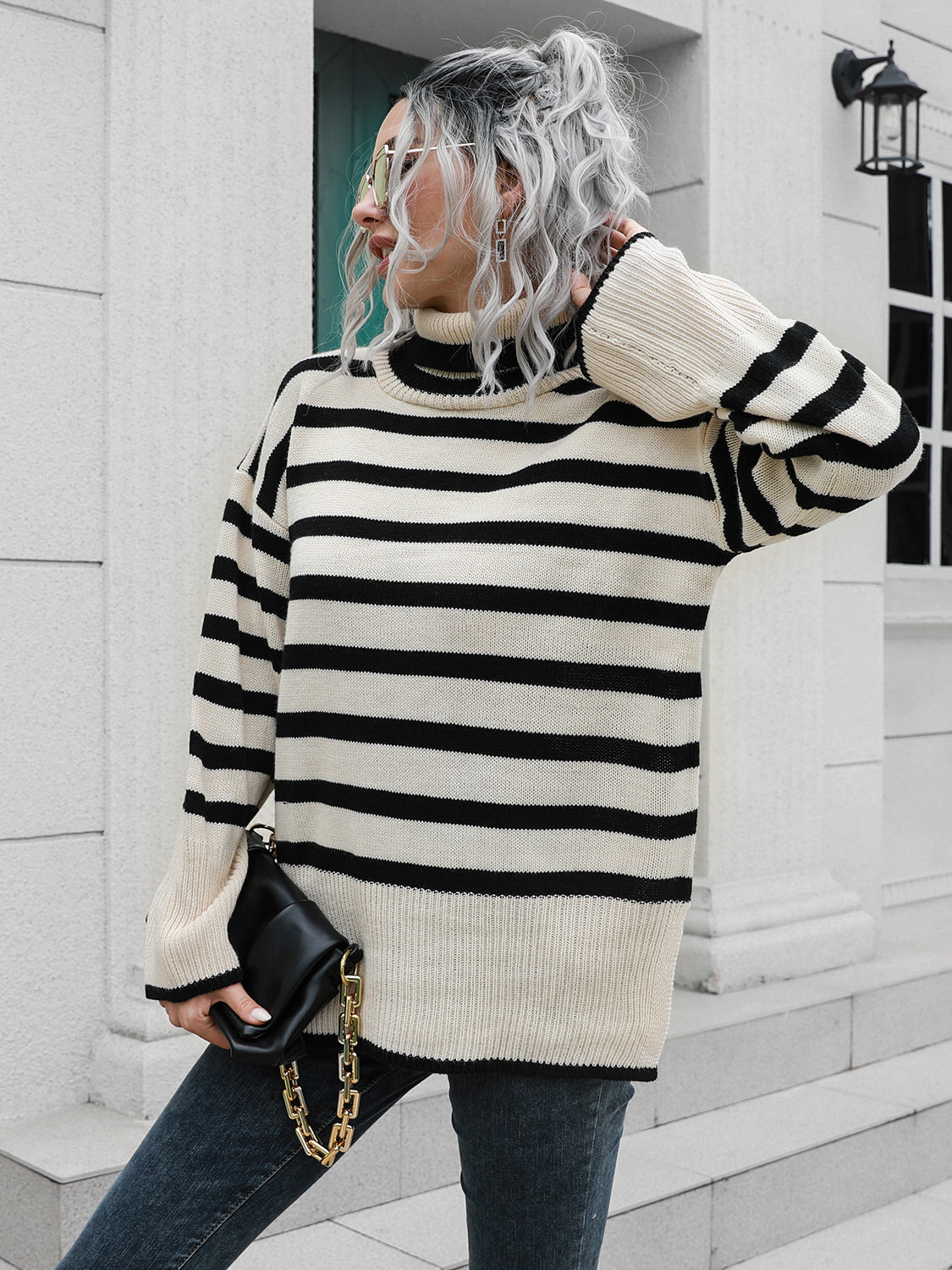 Flared sleeve striped turtleneck sweater in black and beige acrylic with a relaxed fit.