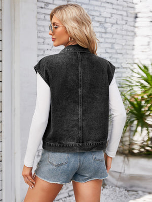 Sleeveless black washed denim utility jacket with collar and button front detail.