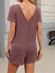 Textured V-neck knit romper in Purple Red with short sleeves and side pockets.