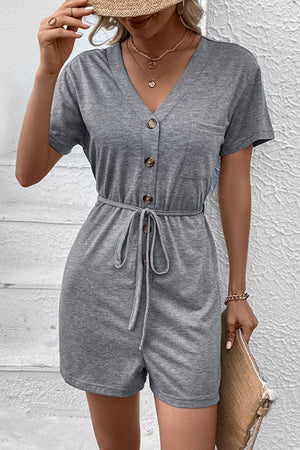 Gray Dawn button-front romper with short sleeves, V-neck, waist tie and chest pocket.