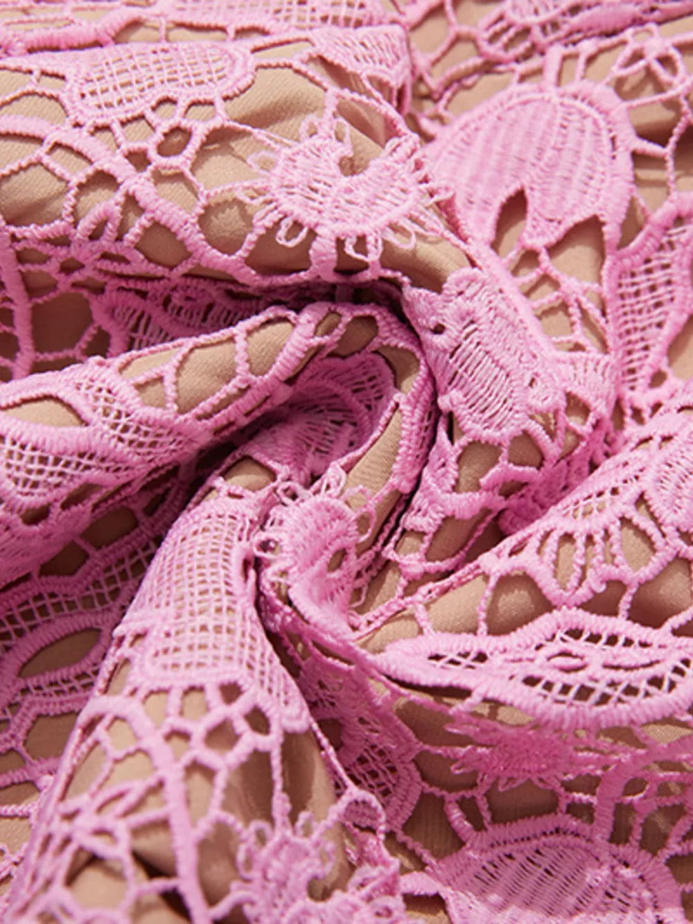 Pink lace midi dress with intricate floral detail and nude lining.