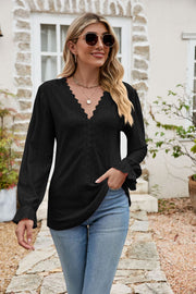 Black eyelet lace blouse with ruffle sleeves and V-neck