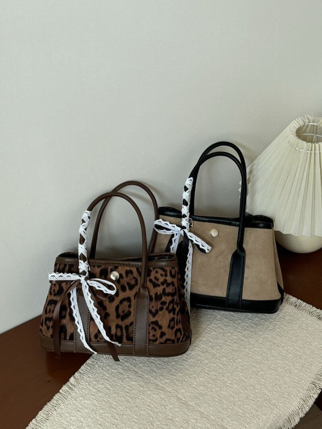 Leopard print tote bag with lace trim and brown trim.