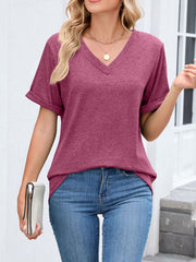 Wine Red V-neck t-shirt with cuffed short sleeves, styled with jeans and a necklace.