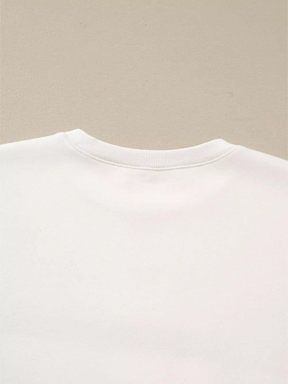 White cotton crewneck pullover pajama top detail