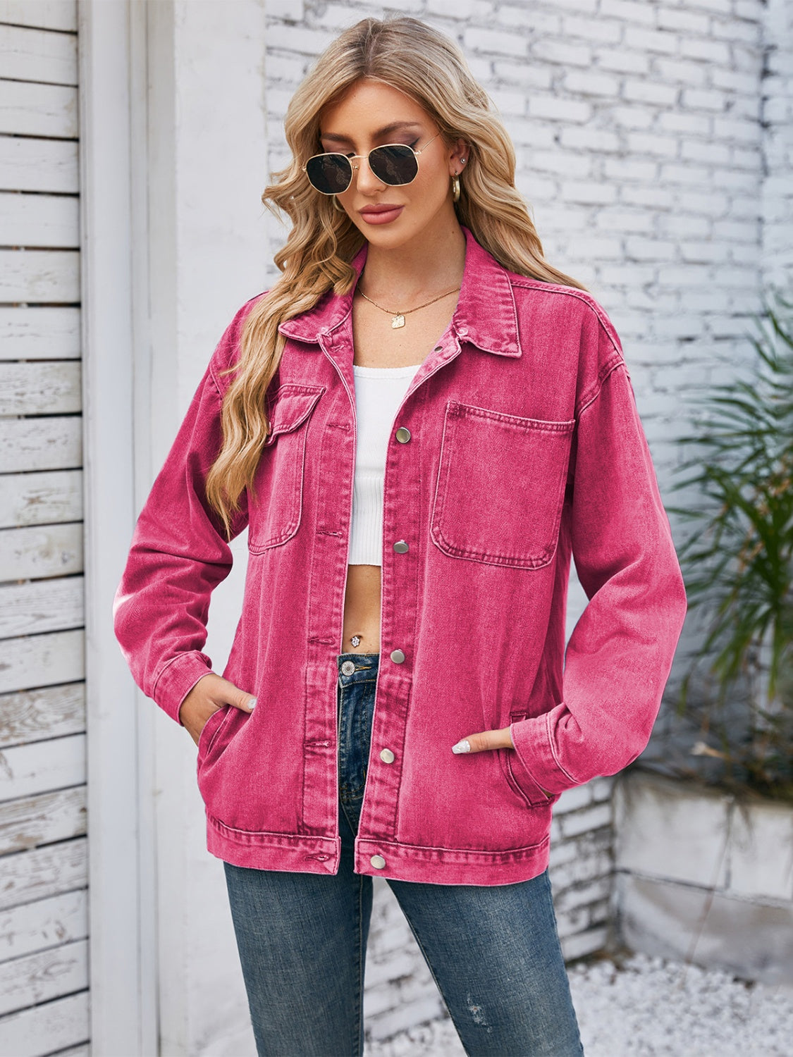 Oversized hot pink denim jacket with hood detail, buttoned front and chest pockets.