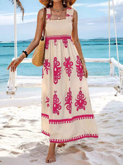 Maxi dress with smocked bodice, square neck, ruffled straps, and pink border print.