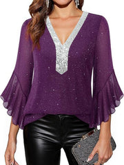 Purple sequin V-neck blouse with bell sleeves and glitter detail.
