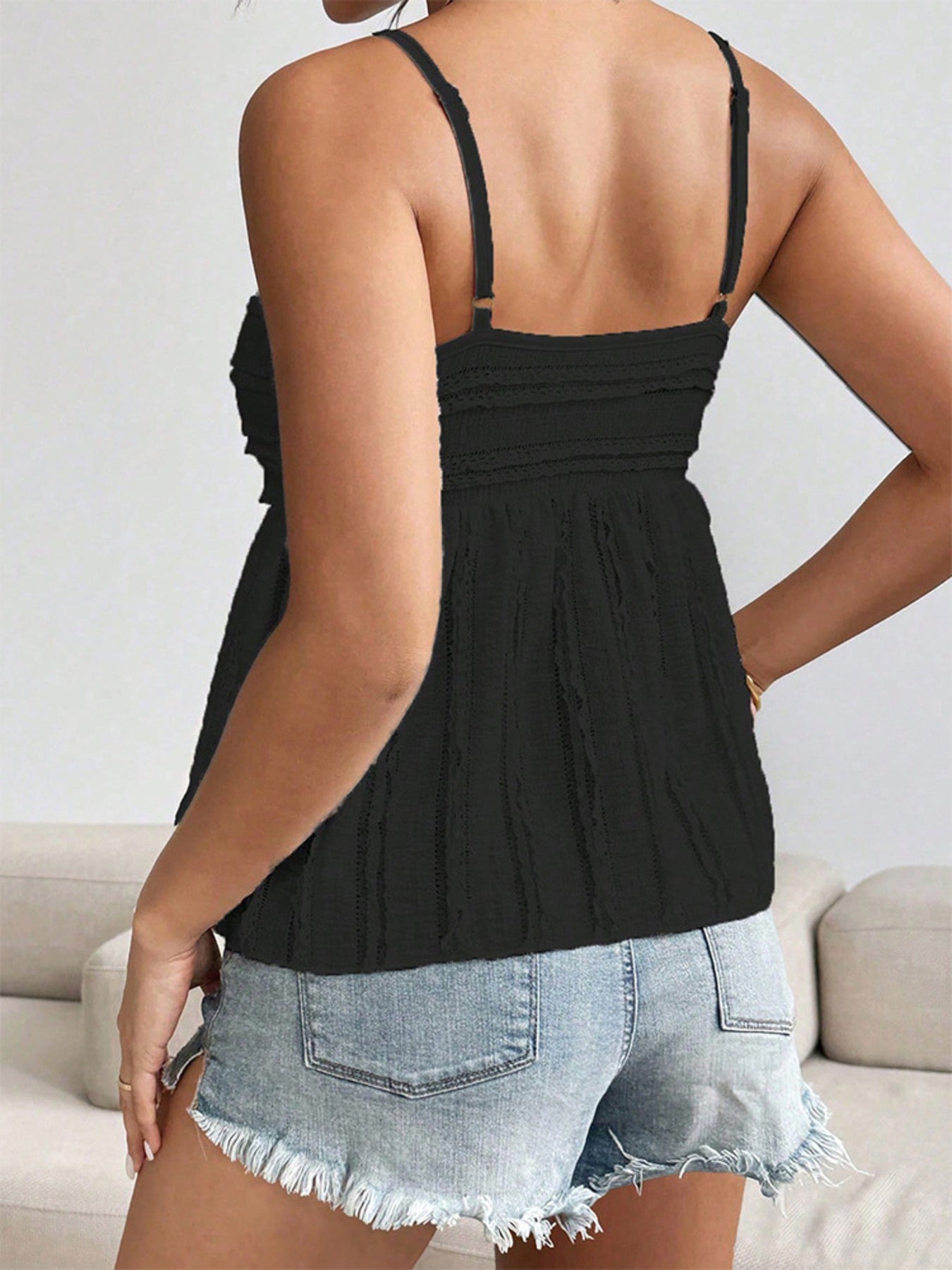 Black cami top with sweetheart neckline and textured fabric detail