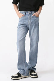 Wide-leg denim jeans in medium wash with carpenter pockets and a relaxed fit.