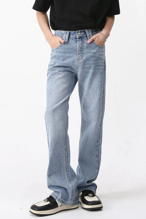 Wide-leg denim jeans in medium wash with carpenter pockets and a relaxed fit.