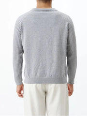 Light gray cotton knit polo top with ribbed sleeves and collar.