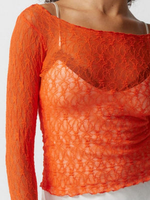 Orange floral lace blouse with scalloped edge and boat neck.