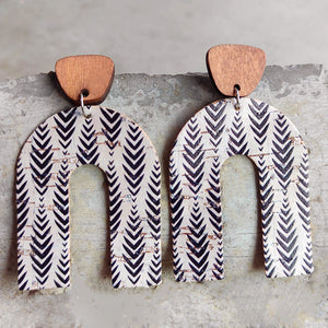 Archway cork statement earrings with wood tops and black chevron pattern.