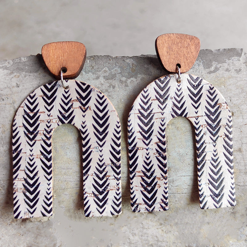 Archway cork statement earrings with wood tops and black chevron pattern.
