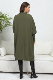 Army green oversized knit cardigan with pockets, long sleeves, and a relaxed fit.