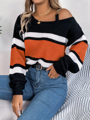 Asymmetric stripe knit sweater with shoulder detail in black, white, and terracotta orange.