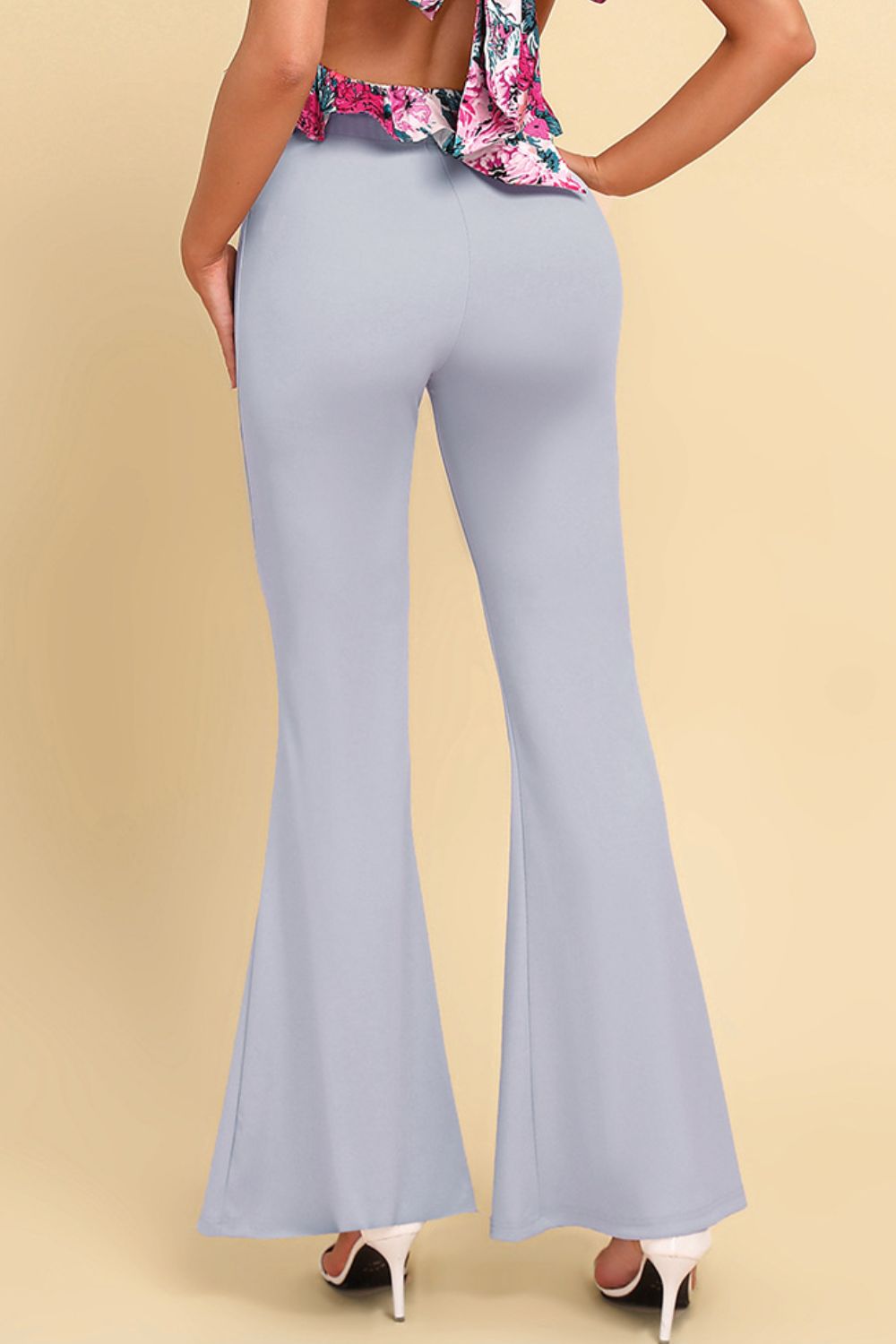 Light gray sculpted flare leggings with a high waist and flared hem.