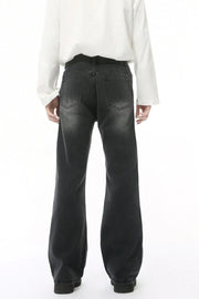 Dark wash wide leg jeans with back pockets and a faded look.