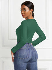 Dark Green long sleeve ribbed jersey bodysuit with a crew neck.
