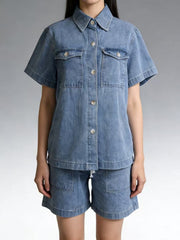 Button-up denim top and shorts set in sky blue with collared neckline and short sleeves.